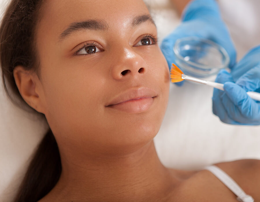 Young woman getting a facial peel