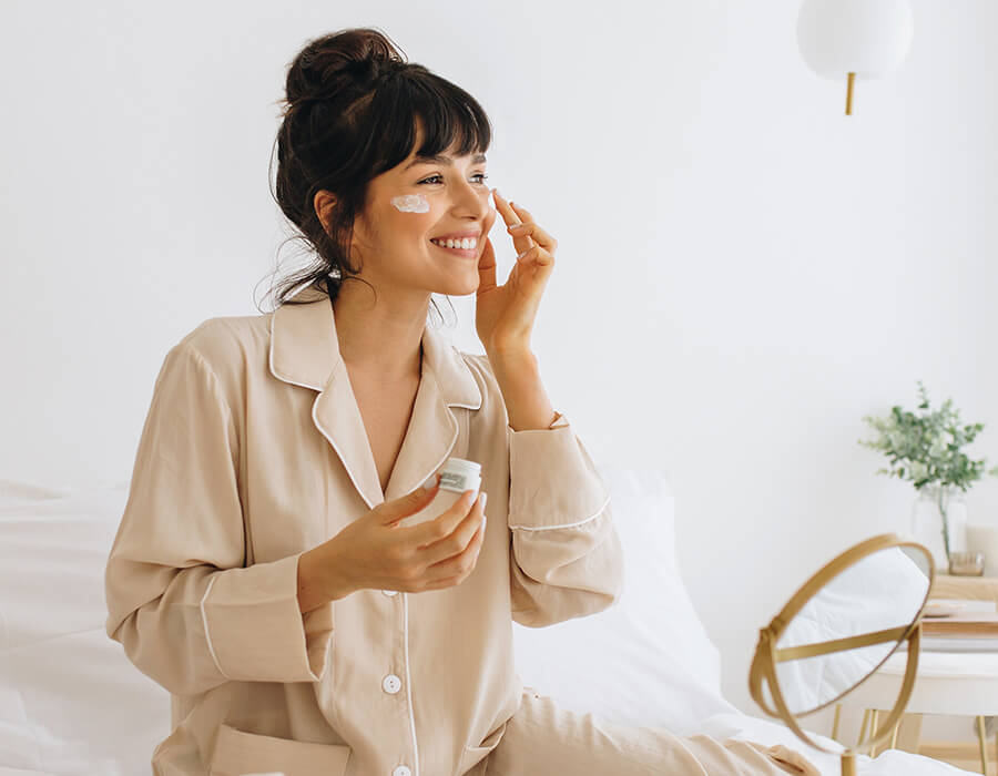 Woman applying eye cream